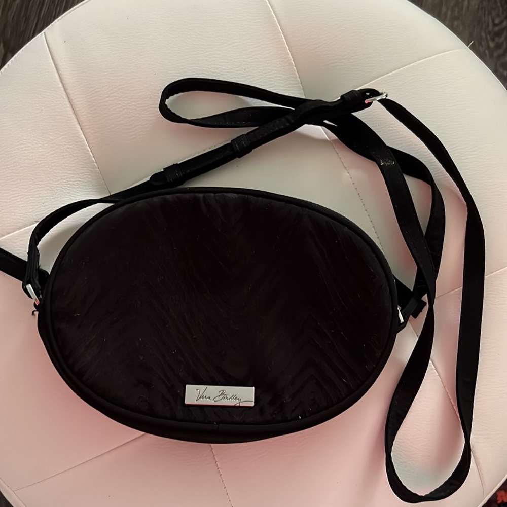 Vera Bradley black crossbody circle purse.